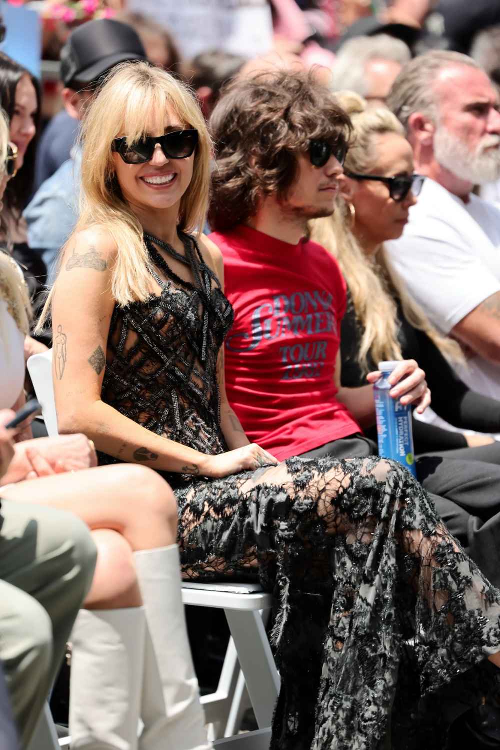 Miley Cyrus Rocks Naked Dress With Family at Walk of Fame GettyImages-2277710863
