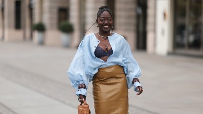 BERLIN, GERMANY - APRIL 24: Lois Opoku seen wearing a fresh, coordinated look with a soft, contemporary feel. She styles a matching skirt and blouse set by The Latest, creating a harmonious and polished silhouette. The outfit is complemented by Zara heels, adding height and a refined finish. She carries an brown MCM bag, introducing a bold designer element that contrasts with the clean lines of the ensemble. ASOS silver earrings add a subtle yet stylish accent, completing the look with a touch of modern elegance on April 24, 2026 in Berlin, Germany. (Photo by Jeremy Moeller/Getty Images)