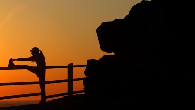 Getty Images 59075159 Woman stretching in the early morning