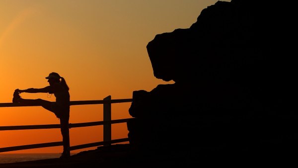 Getty Images 59075159 Woman stretching in the early morning
