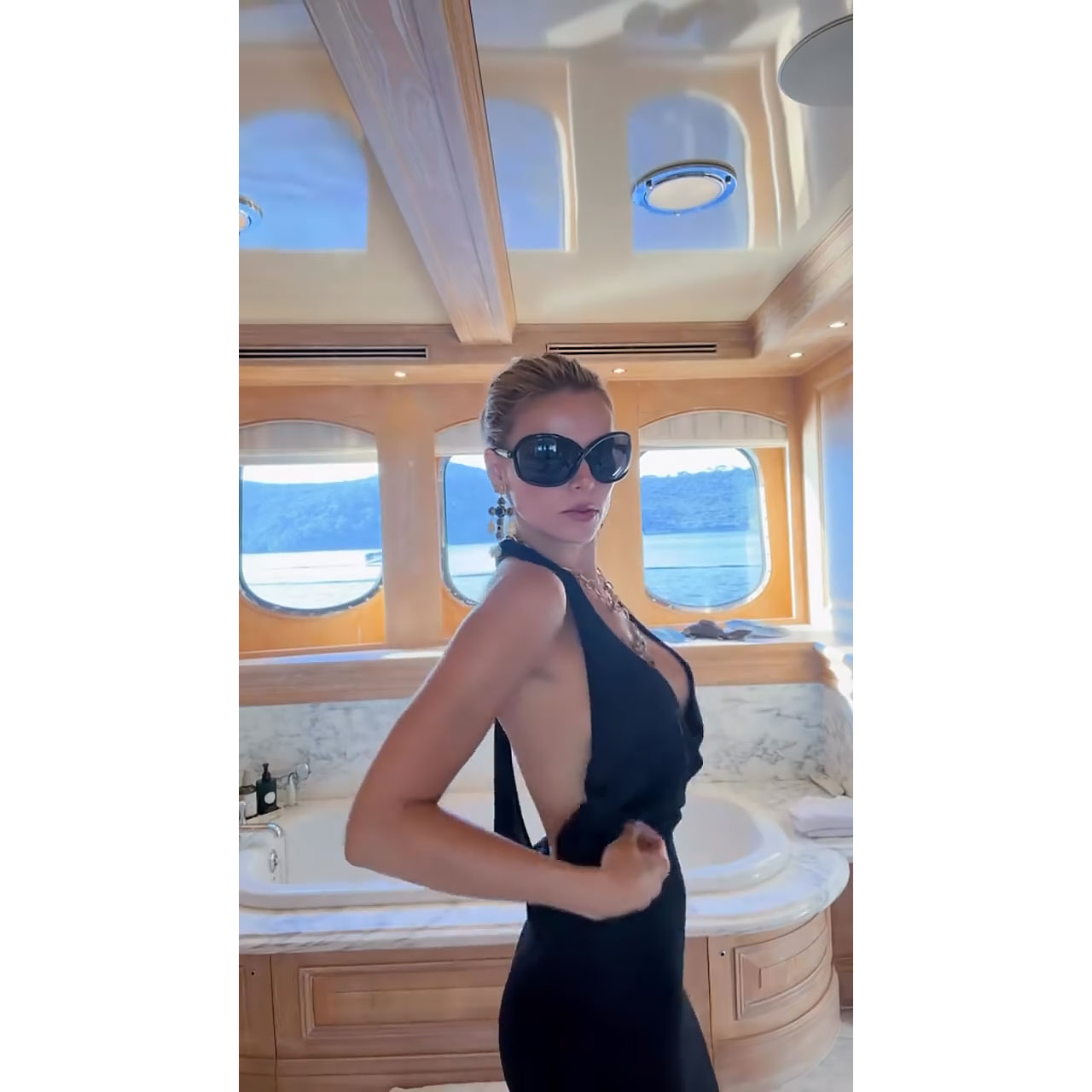 Brooks Nader Narrowly Avoids Wardrobe Malfunction in Risque Dress on a Yacht