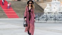 Alexandra Lapp wearing Boho Style, a red and cream floral print maxi dress from Philosophy di Lorenzo Serafini in sheer silk chiffon and bold black trims with a ribbon tie, Toubootfrou ankle boots with rete, organze and suede in black from Christian Louboutin, Celine Audrey sunglasses in black, Maison Maison Michel hat Virginie fedora, MCM Patricia Shoulder Bag in a vintage shape during the Mercedes-Benz Fashion Week Berlin Spring/Summer 2018 on July 7, 2017 in Berlin, Germany.