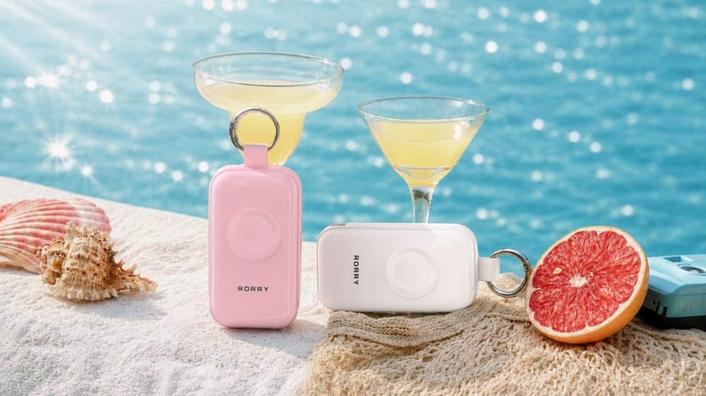 Image Alt Text: RORRY CharmGo portable charger in Rose Quartz with compact seaglass-inspired design
