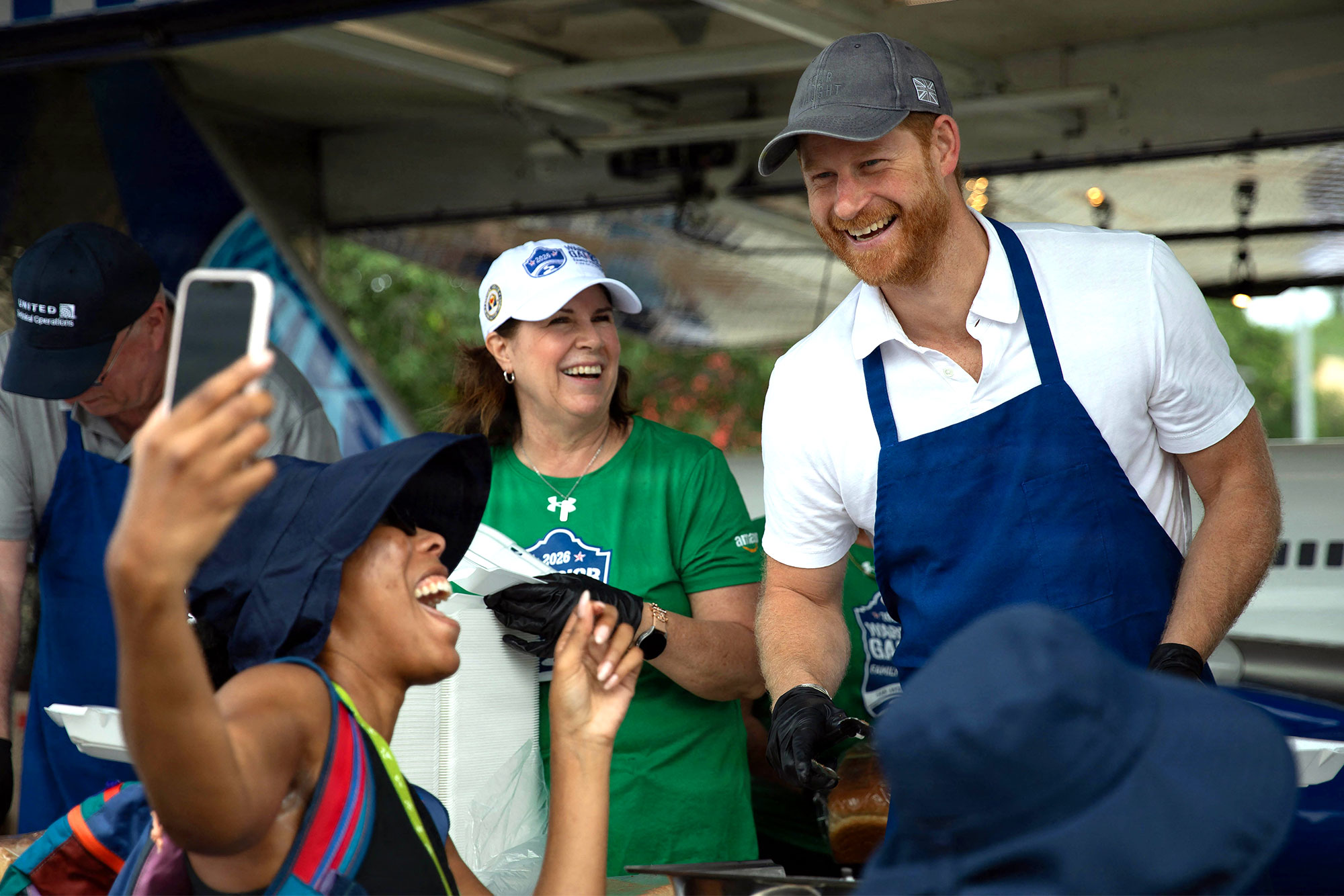 Prince Harry serves BBQ lunches Warrior Games Hot Pics