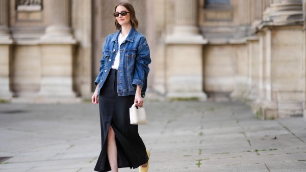 PARIS, FRANCE - MAY 25: Marissa Cox wears an Arket black skirt, an Arket white t-shirt, a blue oversize Agolde denim jacket, ATP Atelier pale pastel yellow flats / shoes, a white Arket leather bag, Jimmy Fairly x Reformation sunglasses, and Alighieri necklace, during a street style fashion photo session, on May 25, 2024 in Paris, France. (Photo by Edward Berthelot/Getty Images)