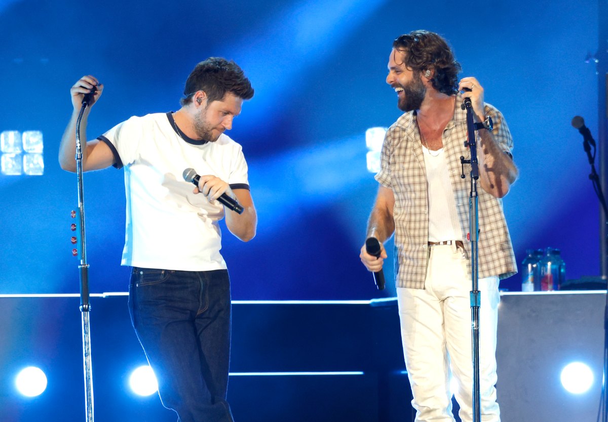 Niall Horan and Thomas Rhett performing together at Geodis Park in Nashville.