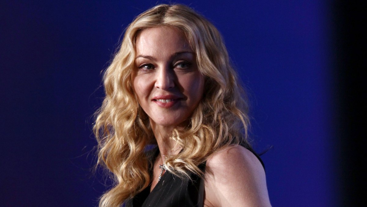 INDIANAPOLIS, IN - FEBRUARY 02: Singer Madonna looks on on during a press conference for the Bridgestone Super Bowl XLVI halftime show at the Super Bowl XLVI Media Center in the J.W. Marriott Indianapolis on February 2, 2012 in Indianapolis, Indiana. (Photo by Win McNamee/Getty Images)