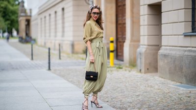 BERLIN, GERMANY - JULY 02: Alexandra Lapp is seen wearing vintage harem pants, a vintage silk blouse, Gucci foulard worn as a headband, Céline Audrey sunglasses, long Chanel earrings, black Chanel tweed bag 2.55, and black Gianvito Rossi Medea sandals during Berlin Fashion Week on July 02, 2019 in Berlin, Germany. (Photo by Christian Vierig/Getty Images)