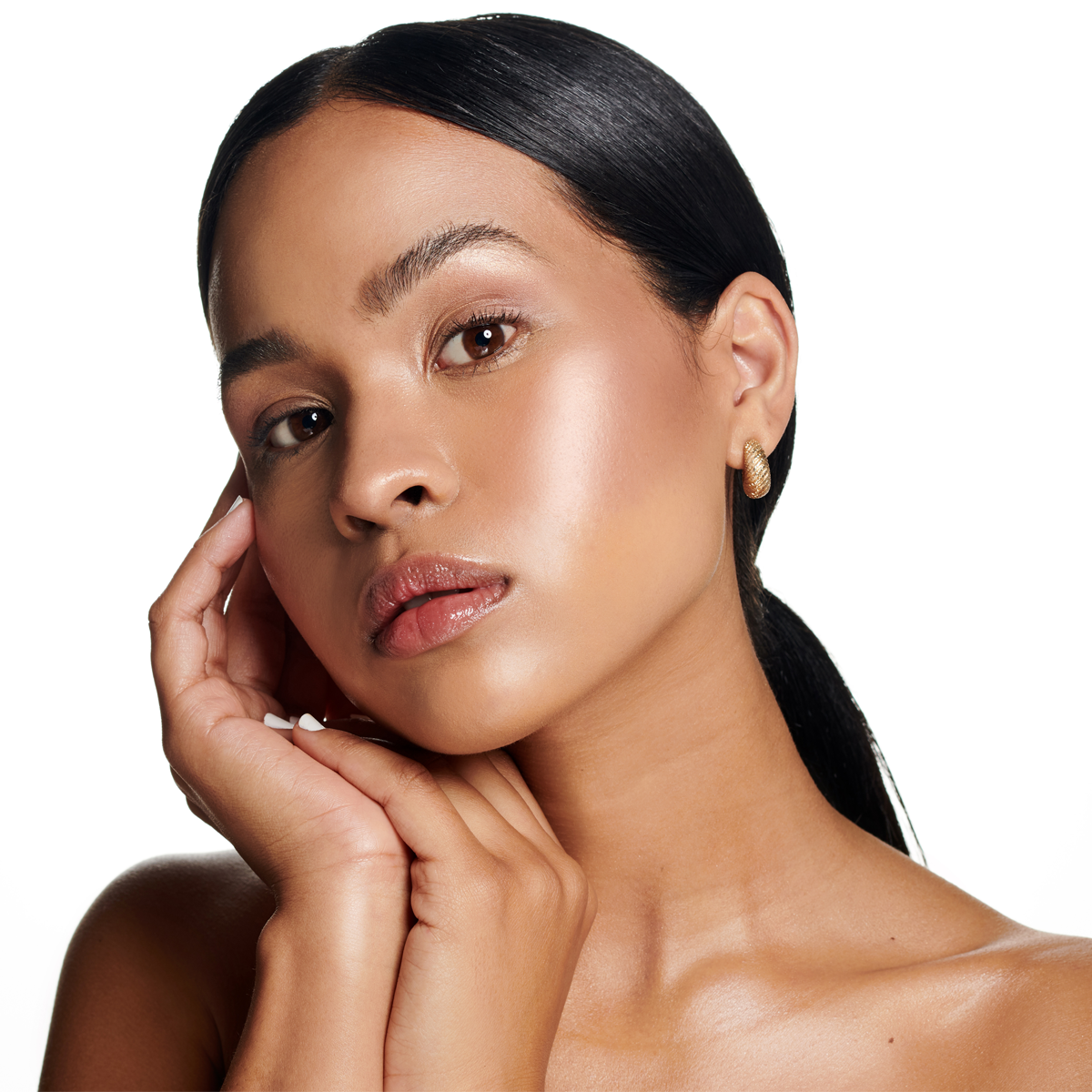 Studio shot of an attractive young woman posing against white background