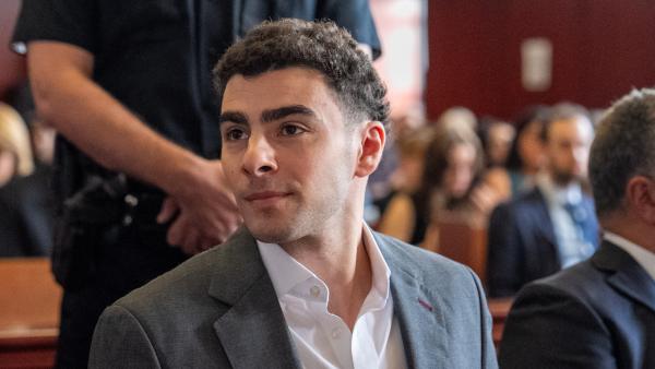 Luigi Mangione sitting in court.