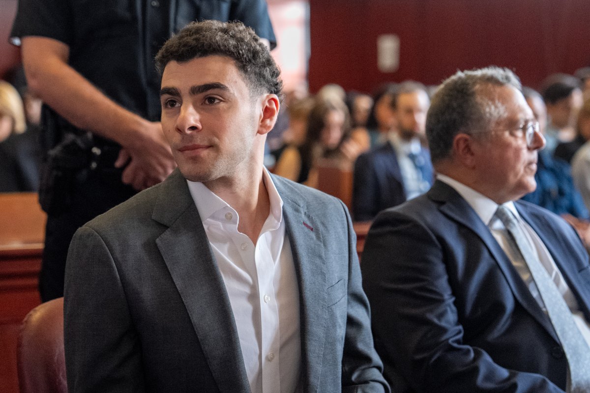 Luigi Mangione sitting in court.
