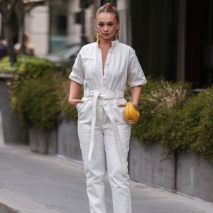 PARIS, FRANCE - JULY 07: A guest is seen wearing white overall, yellow small Fendi bag, golden earrings outside outside Fendi, during Paris Fashion Week - Haute Couture Fall Winter 2022 2023, on July 07, 2022 in Paris, France. (Photo by Jeremy Moeller/Getty Images)