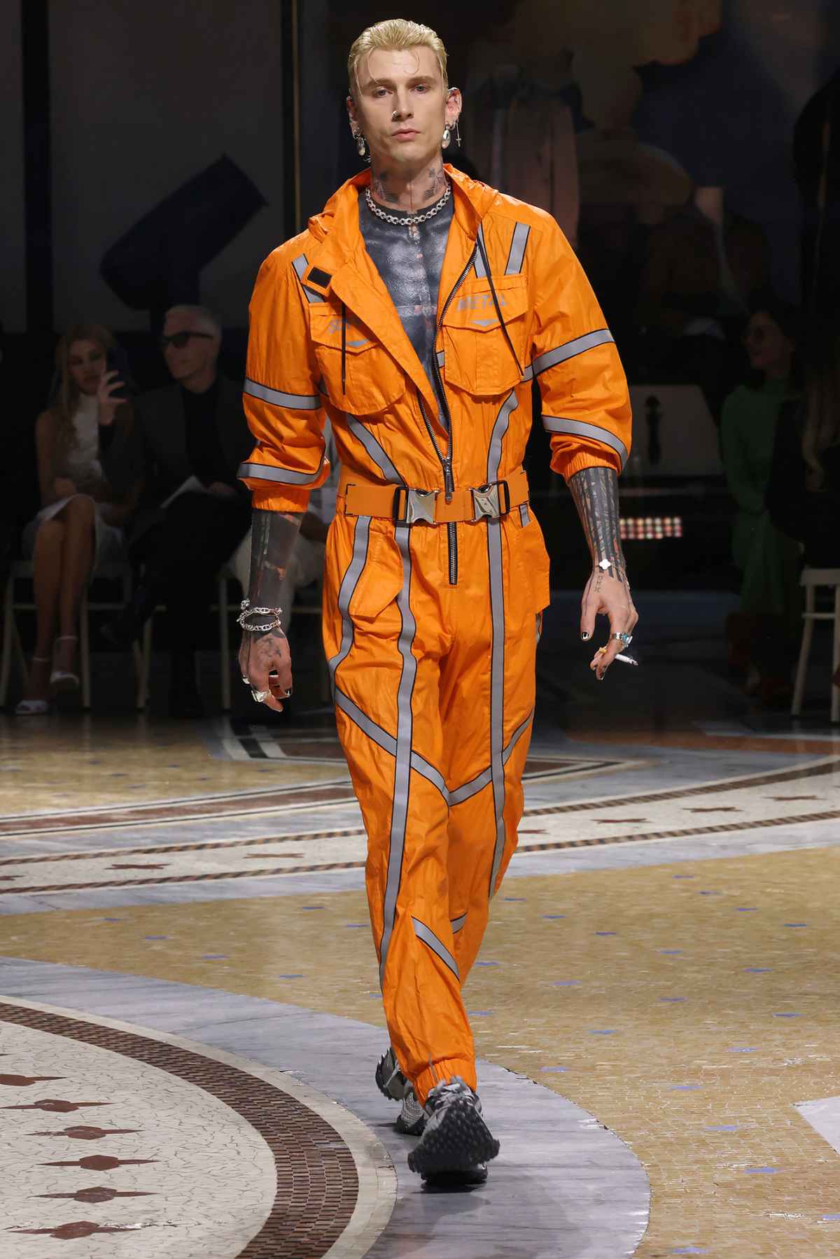 Feature MGK Walks Milan Fashion Week Runway With Dakota Johnson Sitting in Front Row After 1st Date