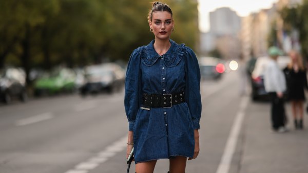 Celine Bethmann wearing a jeans dress, a black bag and black overknee boots on September 13, 2021 in Berlin, Germany.