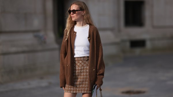 PARIS, FRANCE - OCTOBER 01: Marie von Behrens is seen wearing a brown plaid skirt, with a white top, a long brown cardigan, with a black Chanel handbag and black-brown sunglasses during the Chanel Show Womenswear Spring/Summer 2025 as part of Paris Fashion Week on October 01, 2024 in Paris, France. (Photo by Jeremy Moeller/Getty Images)