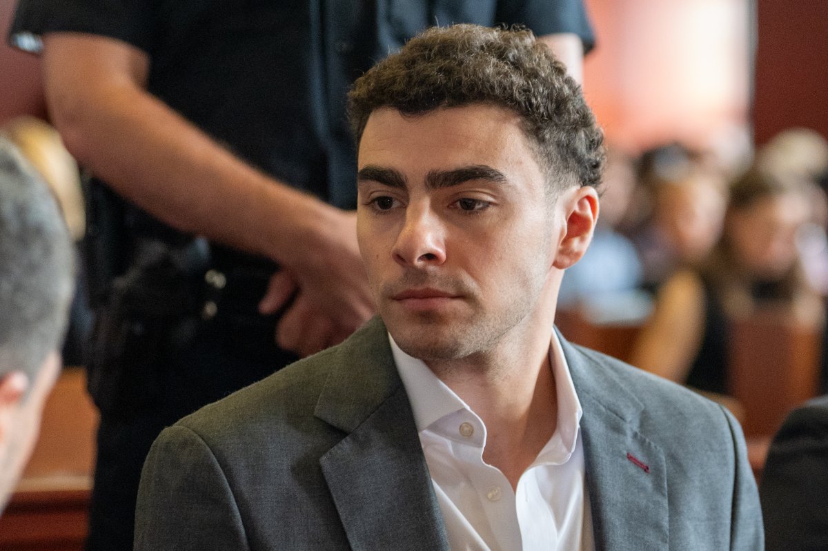 Luigi Mangione sitting in court.