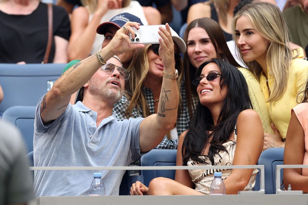 GettyImages-2294939165 Brad Pitt Cuddles Up to Girlfriend Ines de Ramon and Poses for Selfies With Fans at US Open