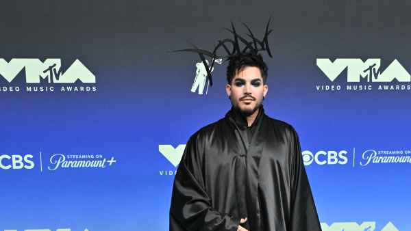 Adam Lambert Brings the Drama to 2026 MTV VMAs Red Carpet in Black Cape and Headpiece