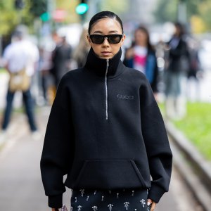 MILAN, ITALY - SEPTEMBER 20: Yuwei Zhangzou wears black zipper, skirt, burgundy bag outside Gucci during the Milan Fashion Week Menswear Spring/Summer 2025 on September 20, 2024 in Milan, Italy. (Photo by Christian Vierig/Getty Images)