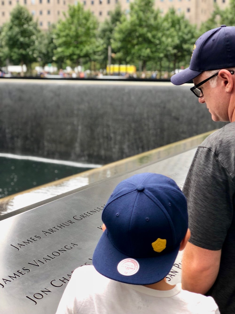 Sean Valentine and his son visiting the 9/11 Memorial.