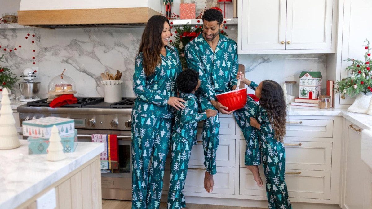 Family wearing matching Christmas pajamas for a holiday photo