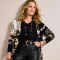Woman wearing Chico's cardigan and leather pants
