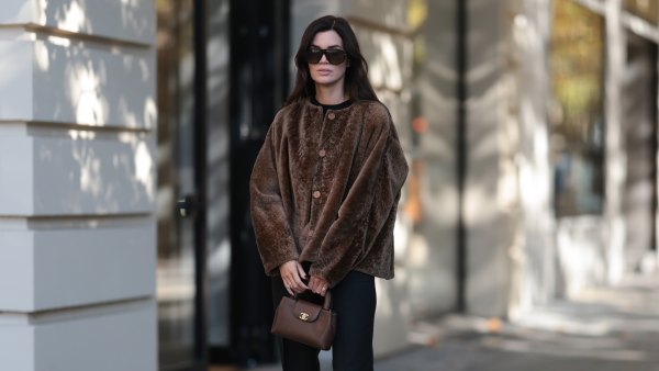 BERLIN, GERMANY - OCTOBER 5: Leo Eberlin seen wearing Tom Ford oversized black sunglasses with dark lenses, Manzoni 24 chocolate brown shearling jacket with a relaxed boxy silhouette and tonal button fastening, Zara fitted black crew-neck top, Leo Mathild diamond jewelry including stud earrings and statement rings, Audemars Piguet yellow gold watch, Chanel structured brown leather top-handle bag with gold-tone CC hardware, Sézane black tailored flared trousers with a clean high-waisted silhouette, Tom Ford black patent leather heels on October 5, 2026 in Berlin, Germany. (Photo by Jeremy Moeller/Getty Images)