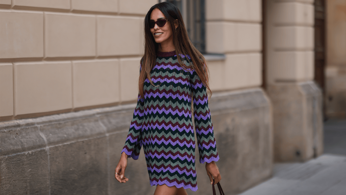 Jill Asemota is seen wearing a purple, blue and green midi Missoni dress, a brown Hermes Constance leather bag and black Fendi sunnies on July 28, 2022 in Berlin, Germany.