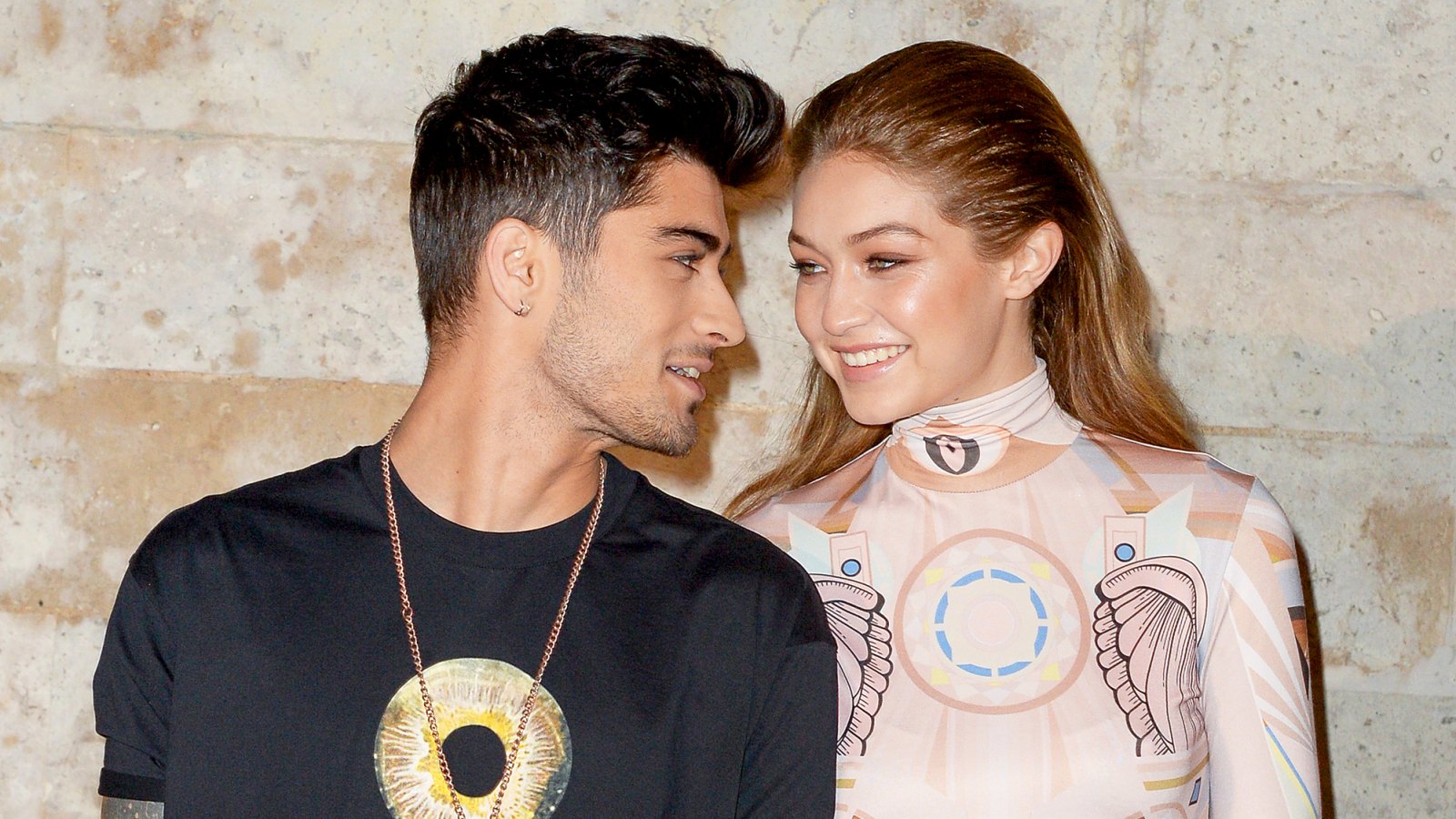 Gigi Hadid and Zayn attend the Givenchy show during Paris Fashion Week in 2016.