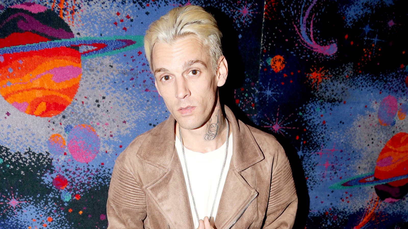 Aaron Carter poses during a handprint ceremony and meet & greet with fans as he visits Planet Hollywood Times Square on April 24, 2017 in New York City.