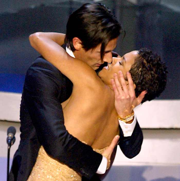 Adrien Brody surprises presenter Halle Berry with a kiss after he won the Oscar for best actor for his work in 'The Pianist'