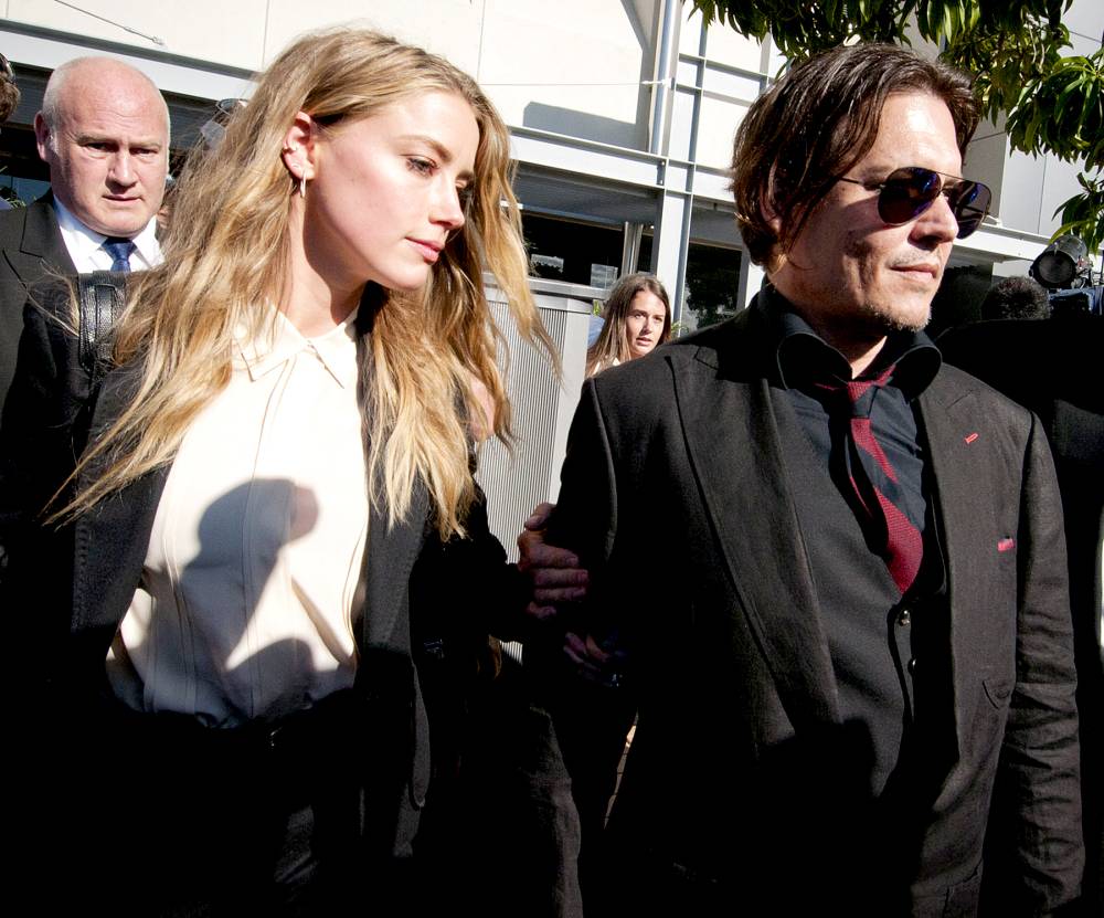 Amber Heard and Johnny Depp, leave Southport Magistrates Court, Queensland, April 18, 2016. Heard received a fine for bringing pet dogs, Pistol and Boo, illegally into Australia in 2015.