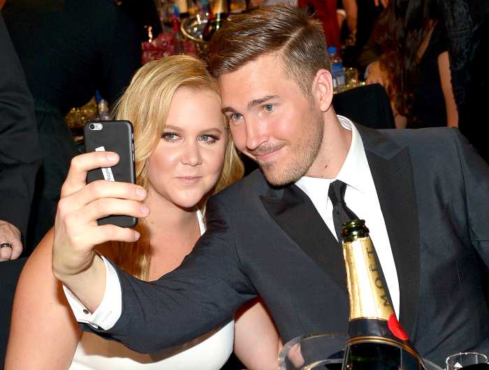Honoree Amy Schumer and designer Ben Hanisch pose for a selfie photo at the 21st Annual Critics' Choice Awards presented by FIJI Water at Barker Hangar on January 17, 2016 in Santa Monica, California.