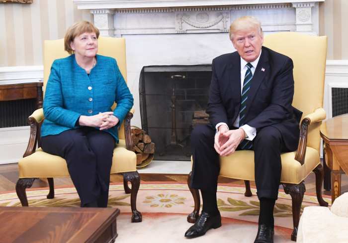 U.S. President Donald Trump, speaks while Angela Merkel, Germany's chancellor, left, listens during a meeting in the Oval Office of the White House in Washington, D.C., U.S., on Friday, March 17, 2017.