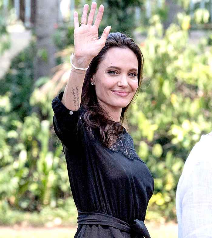 Angelina Jolie greets members of the press while leaving a press conference ahead of the premiere of her new film "First They Killed My Father" set up at the Raffles Grand Hotel D'Angkor on February 18, 2017 in Siem Reap, Cambodia.