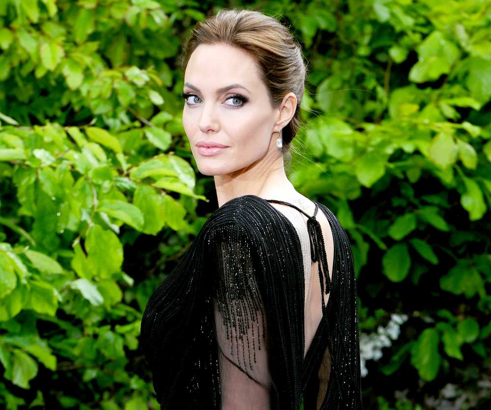 Angelina Jolie attends a private reception as costumes and props from Disney's 'Maleficent' are exhibited in support of Great Ormond Street Hospital at Kensington Palace in London on May 8, 2014.
