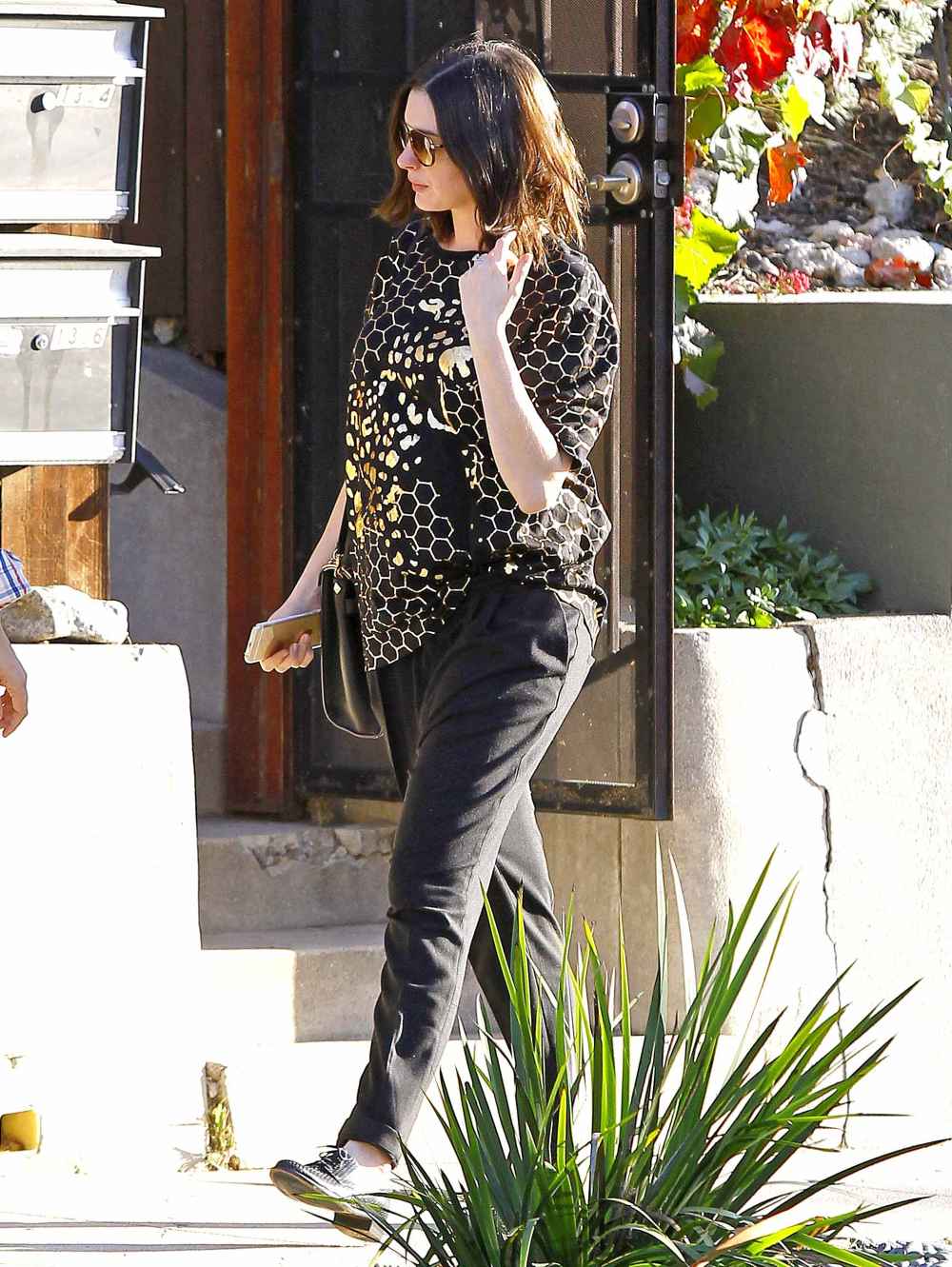 Pregnant Anne Hathaway is spotted leaving a friend's house in Echo Park, California on December 02, 2015.