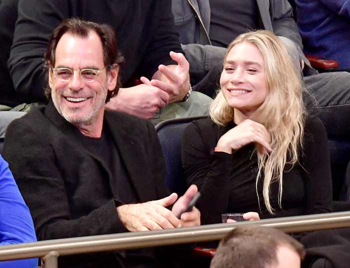 Ashley Olsen and Richard Sachs attend the New York Knicks vs. Brooklyn Nets game at Madison Square Garden on Nov. 9, 2016, in New York City.