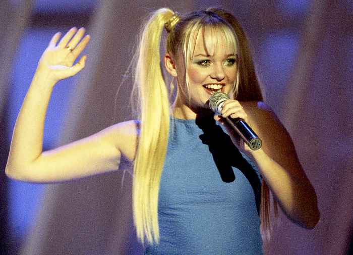 Emma Bunton performing live on stage in 1997.