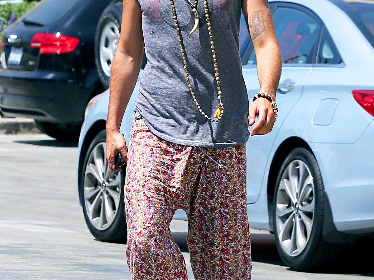 Russell Brand wore baggy printed pants when he stepped out for an iced