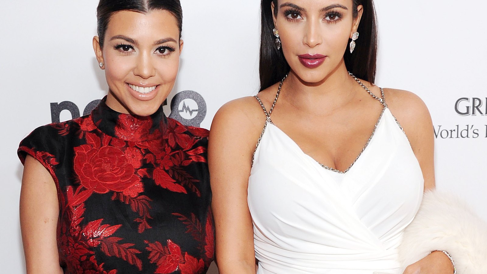 Kourtney Kardashian and Kim Kardashian on February 24, 2013