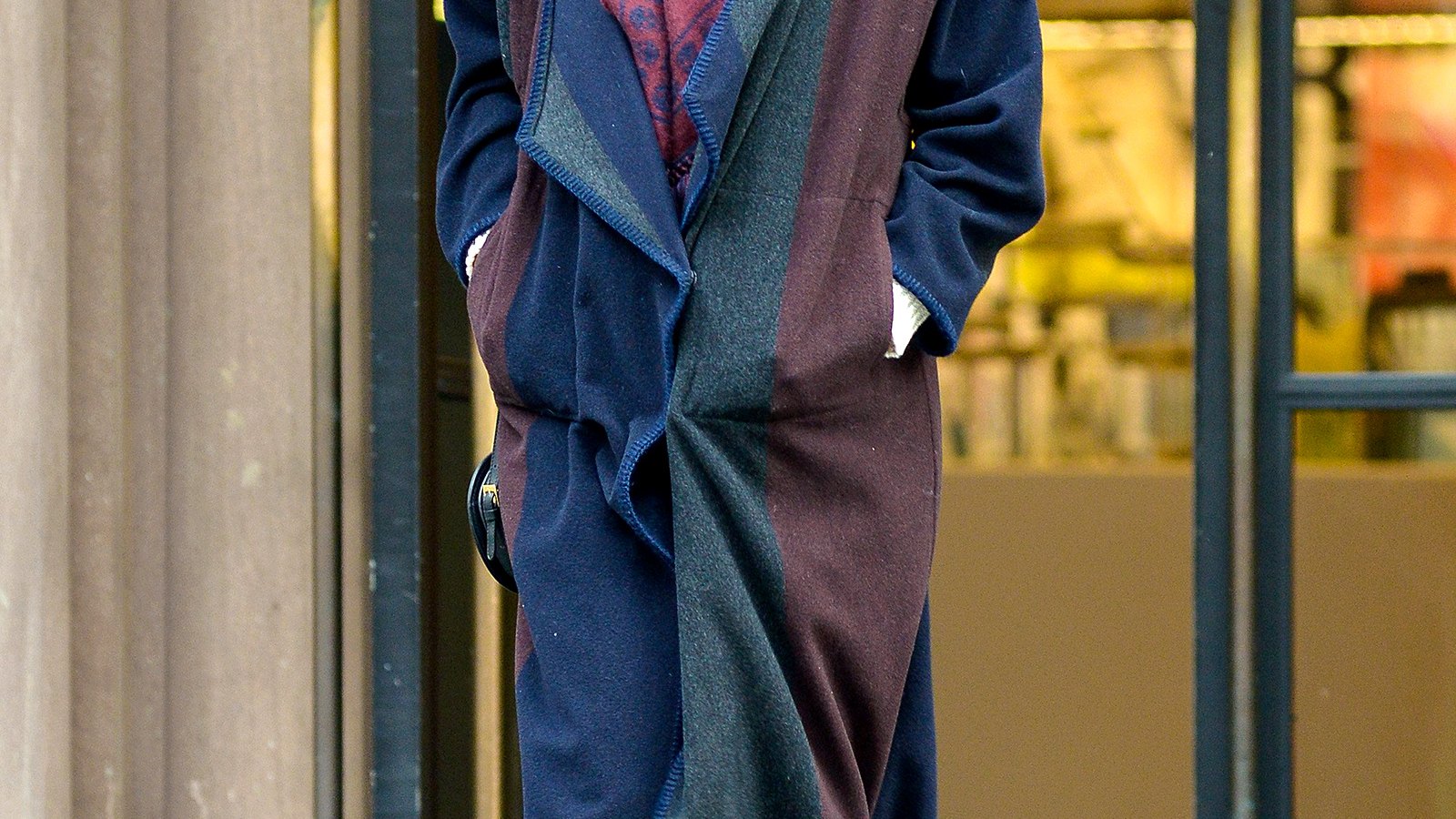 Anne Hathaway wears a skull scarf with a long wool coat on Jan. 20.