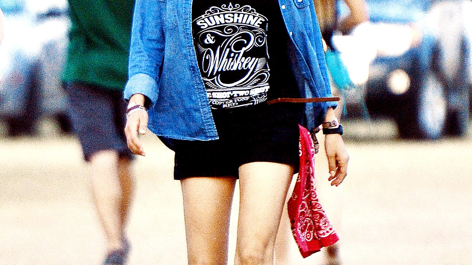 Mila Kunis wears shorts at the Stagecoach Country Music Festival.