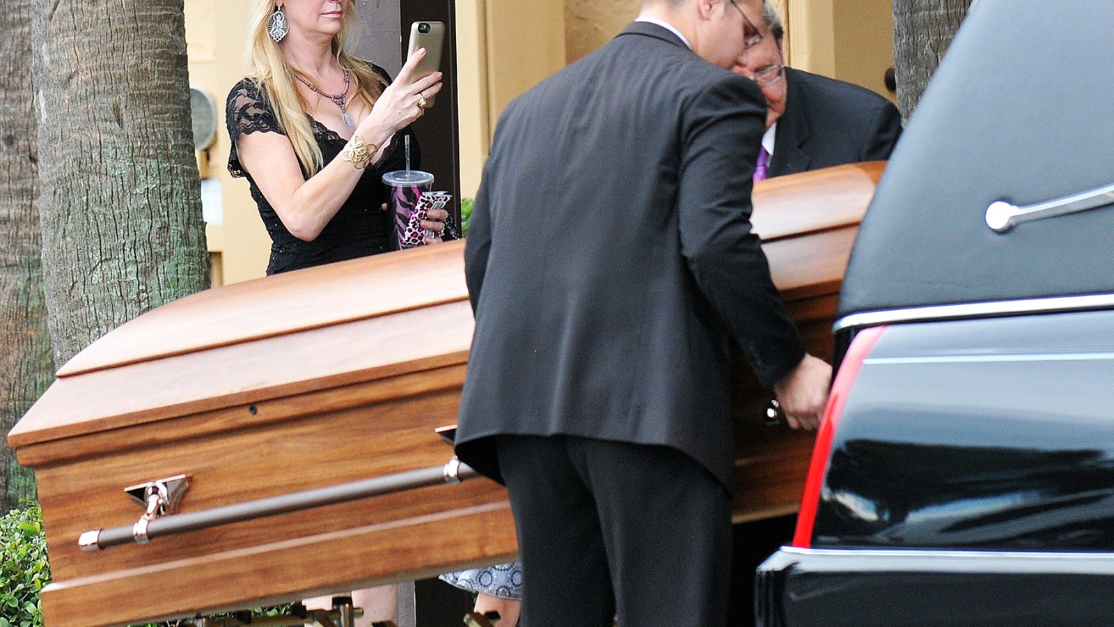 Jackie Seigel taking photos of her daughter's coffin