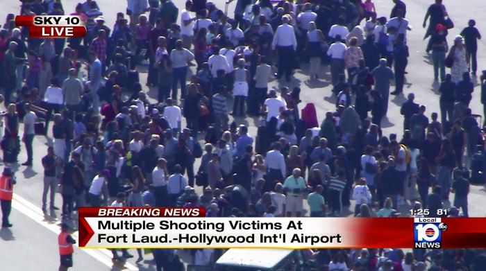 In this still image from video provided by NBC TV Local10, people stand on the tarmac after shots were fired at the international airport in Fort Lauderdale, Fla., Friday, Jan. 6, 2017. Local10 and other news media outlets reported Friday that multiple people were shot.