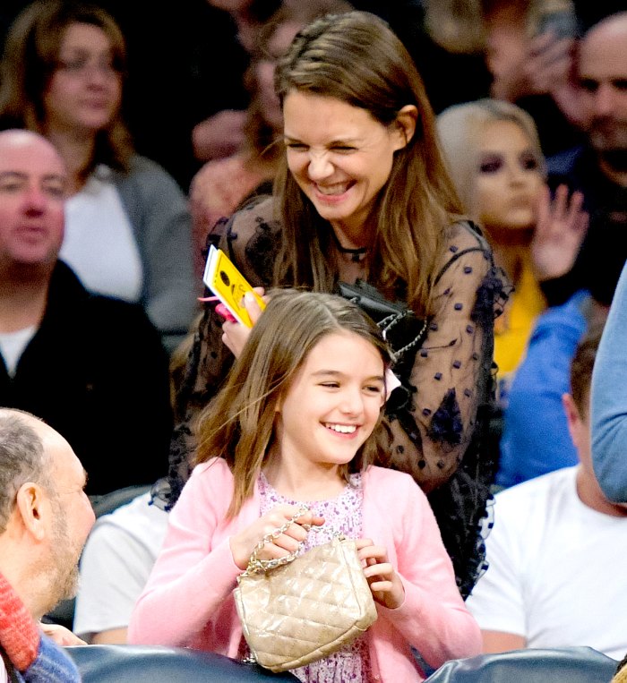 Suri Cruise and Katie Holmes attend a basketball game between the Detroit Pistons and the Los Angeles Lakers at Staples Center on January 15, 2017 in Los Angeles, California.
