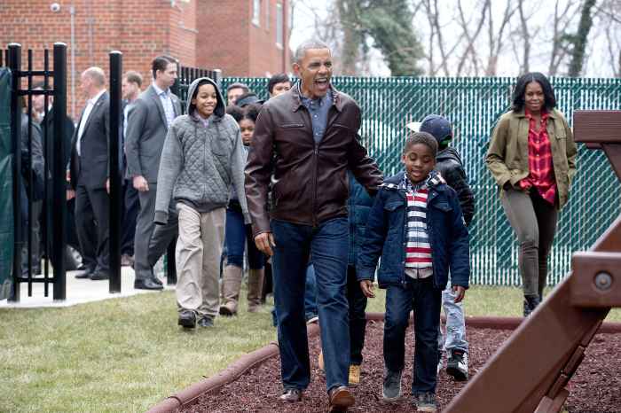 U.S. President Barack Obama and first lady Michelle Obama arrive with children to play on a playset dubbed Malia and Sasha's Castle, formerly used by the Obama children at the White House and donated by the Obama family, during a service marking Martin Luther King Jr. Day at the Jobs Have Priority Naylor Road Family Shelter January 16, 2017 in Washington, DC.