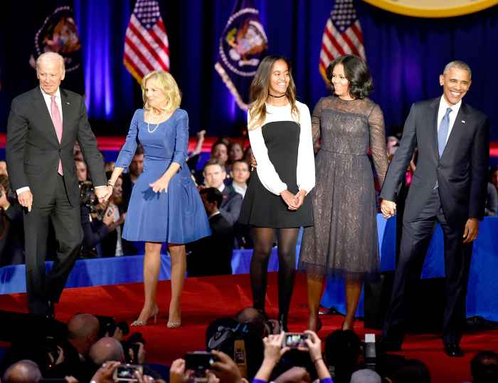 U.S. President Barack Obama is joined on stage by first lady Michelle Obama, their daughter Malia Obama, U.S. Vice President Joseph