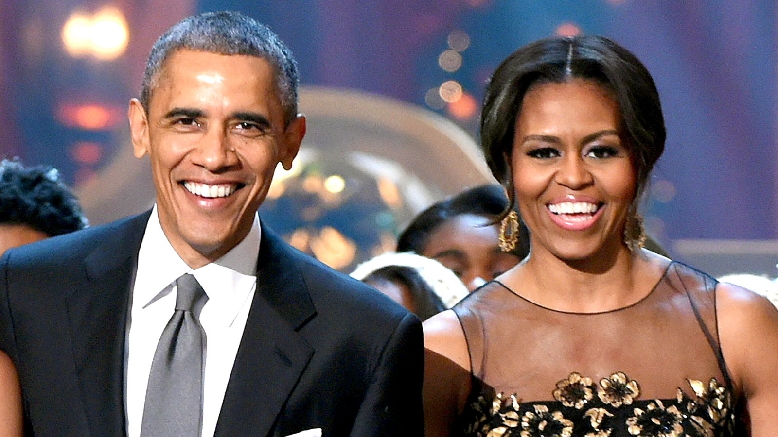 Barack Obama and Michelle Obama speak onstage at TNT Christmas in Washington 2014 at the National Building Museum on December 14, 2014 in Washington, DC.