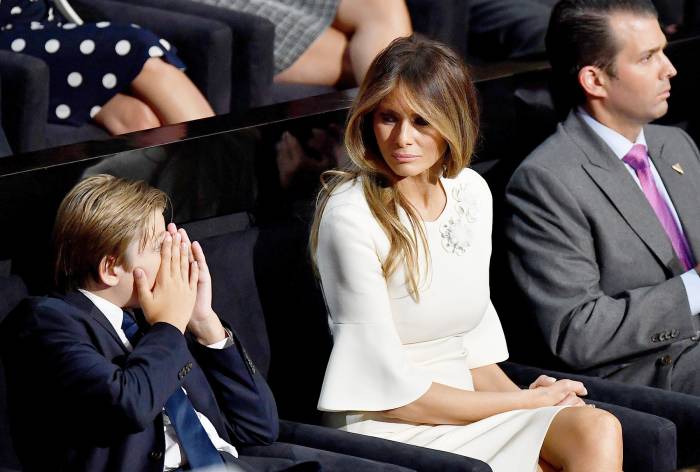 Barron Trump, Melania Trump and Donald Trump Jr. listen to Republican presidential candidate Donald Trump deliver his speech on the fourth day of the Republican National Convention on July 21, 2016 at the Quicken Loans Arena in Cleveland, Ohio.